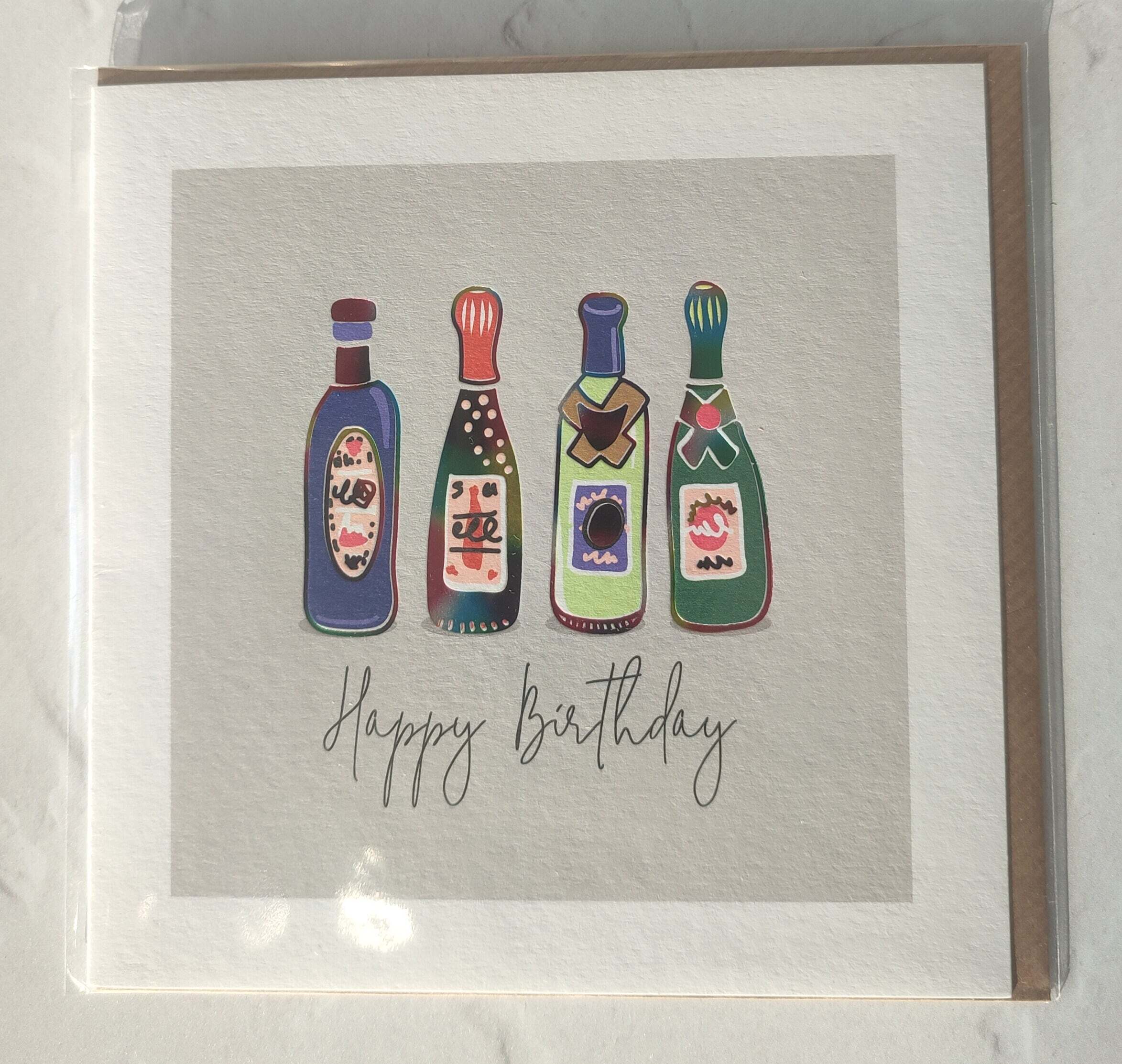 Greeting card with colorful bottle illustrations and 'Happy Birthday' text on a textured background.