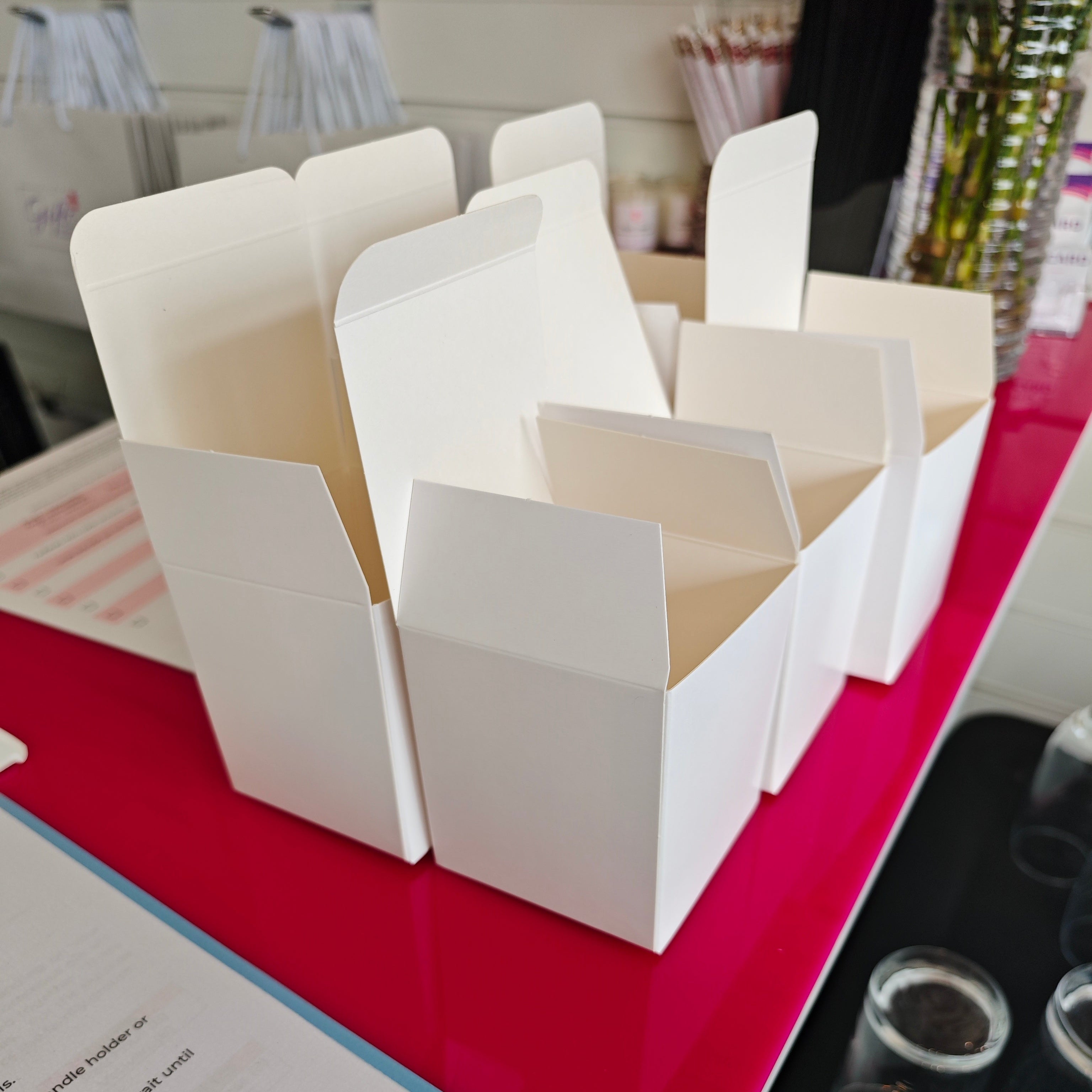 White paper stacks on a red surface with a blurred background
