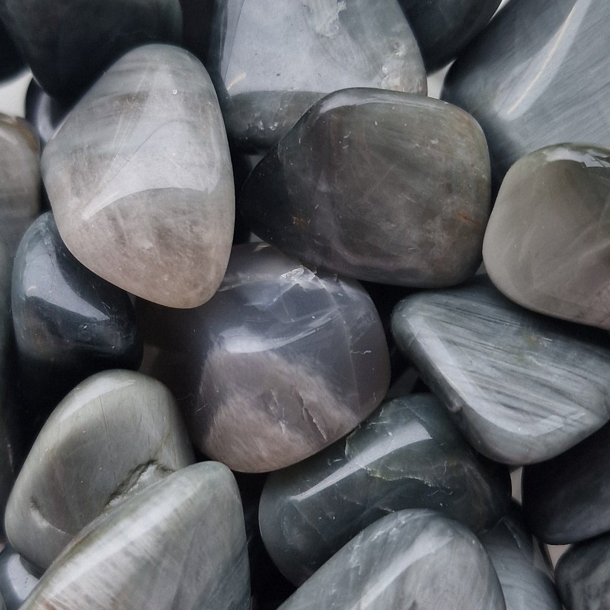 Collection of grey Cats eyes tumblestone