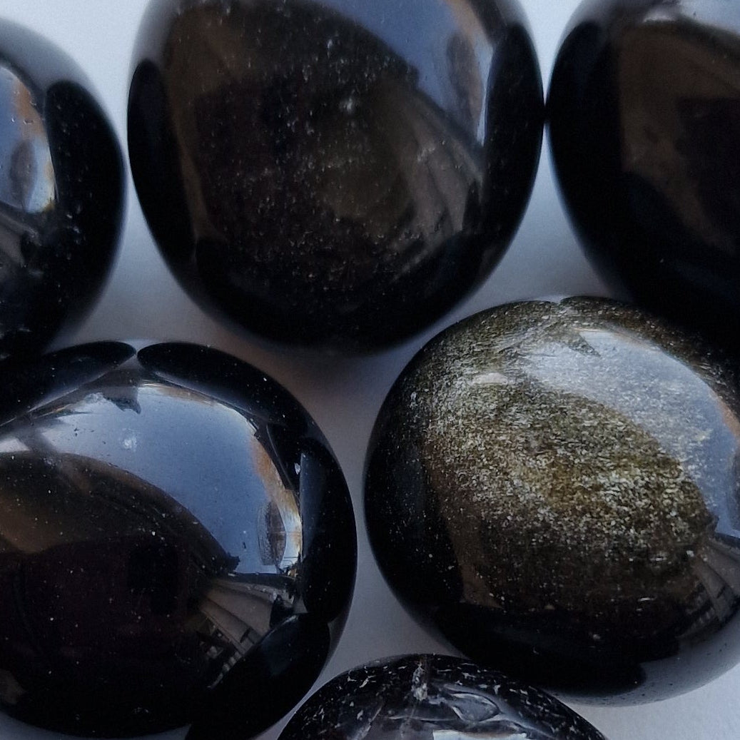Gold Sheen Obsidian Tumblestone on a white background