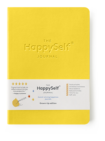 Yellow journal titled 'The HappySelf Journal' on a white background