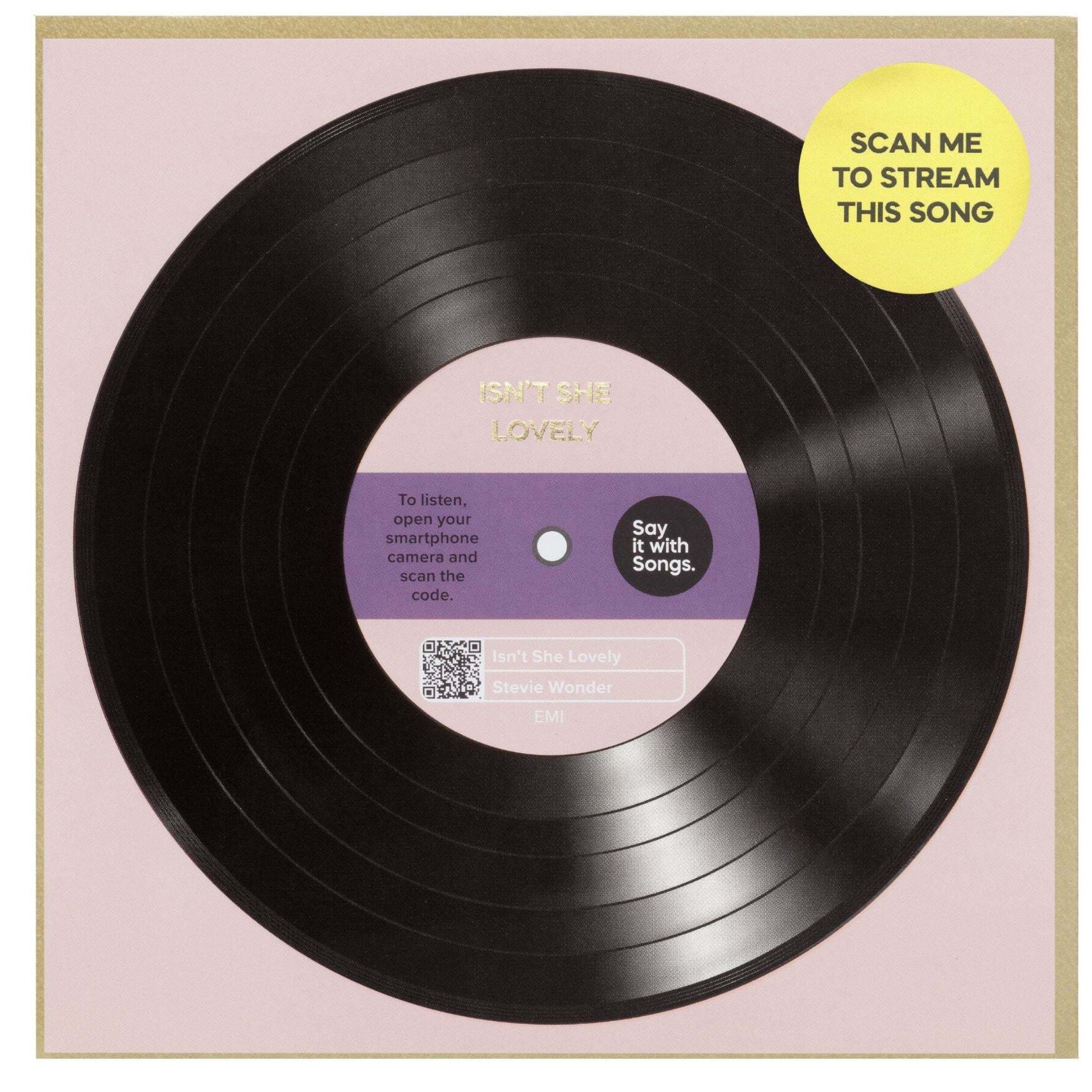 Vinyl record with a label and scan me to stream feature on a pink background