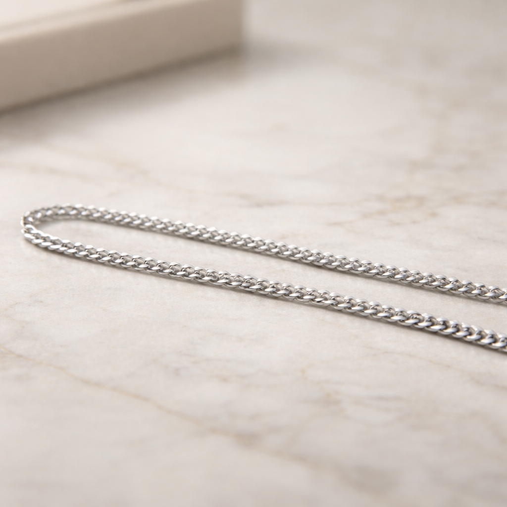 Silver chain on a marble surface