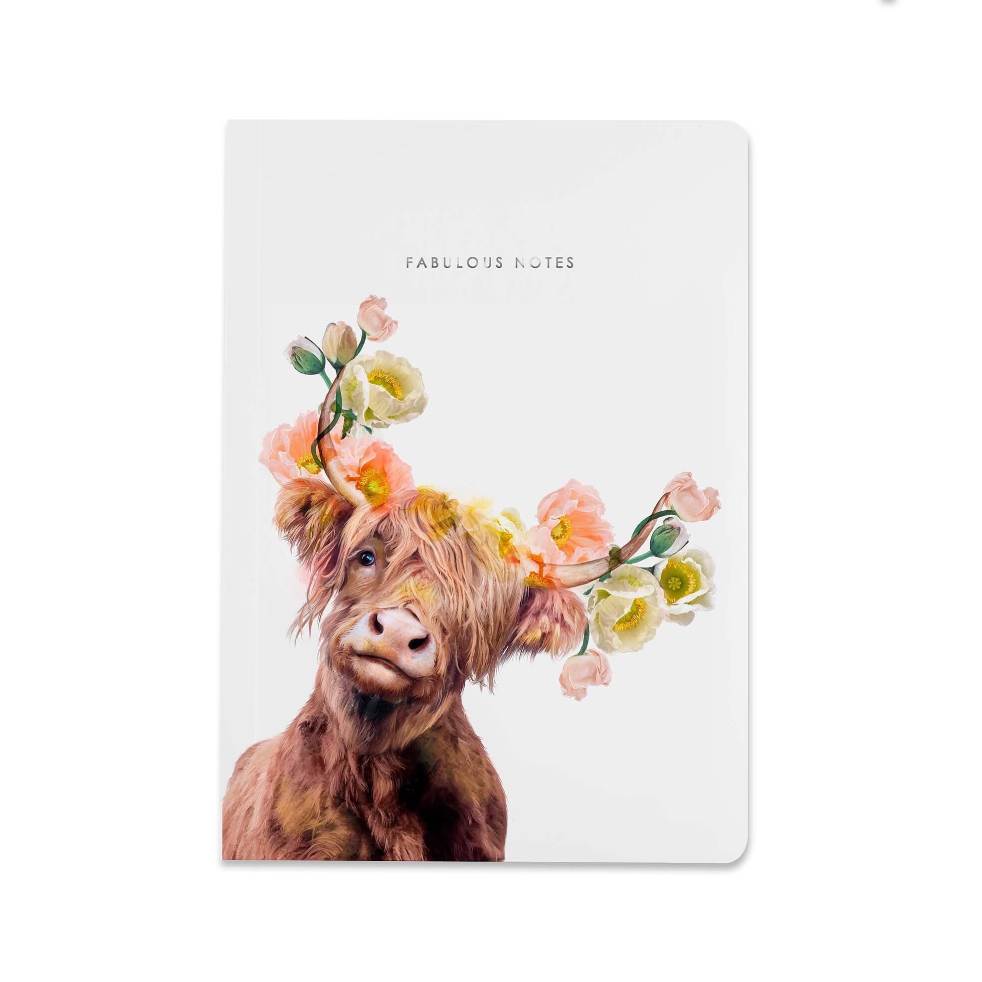 Notebook with a cow wearing a floral headband on a white background