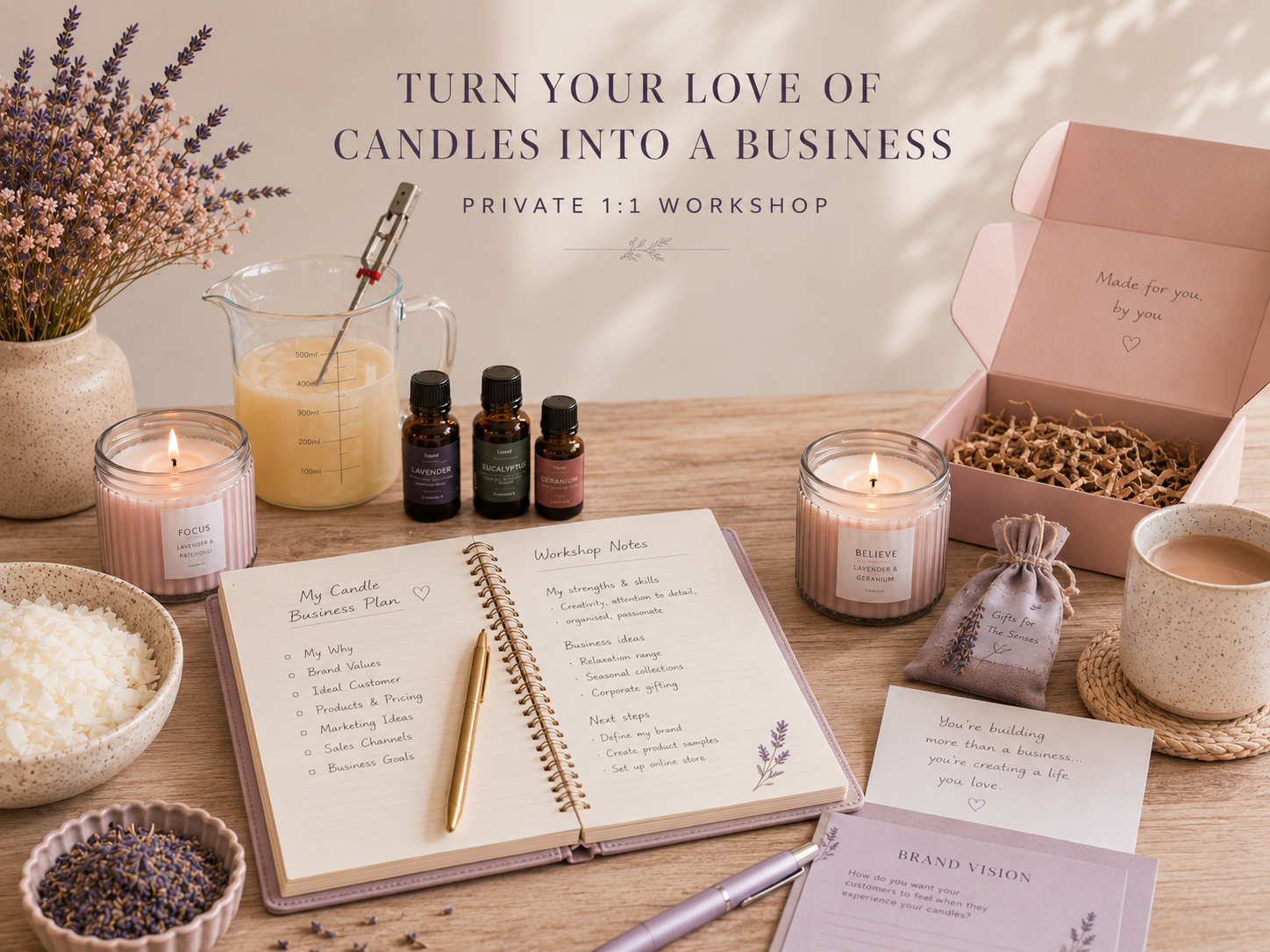 Essential oil bottles with a candle, calculator, note pads with a pen and journal and colour chart
