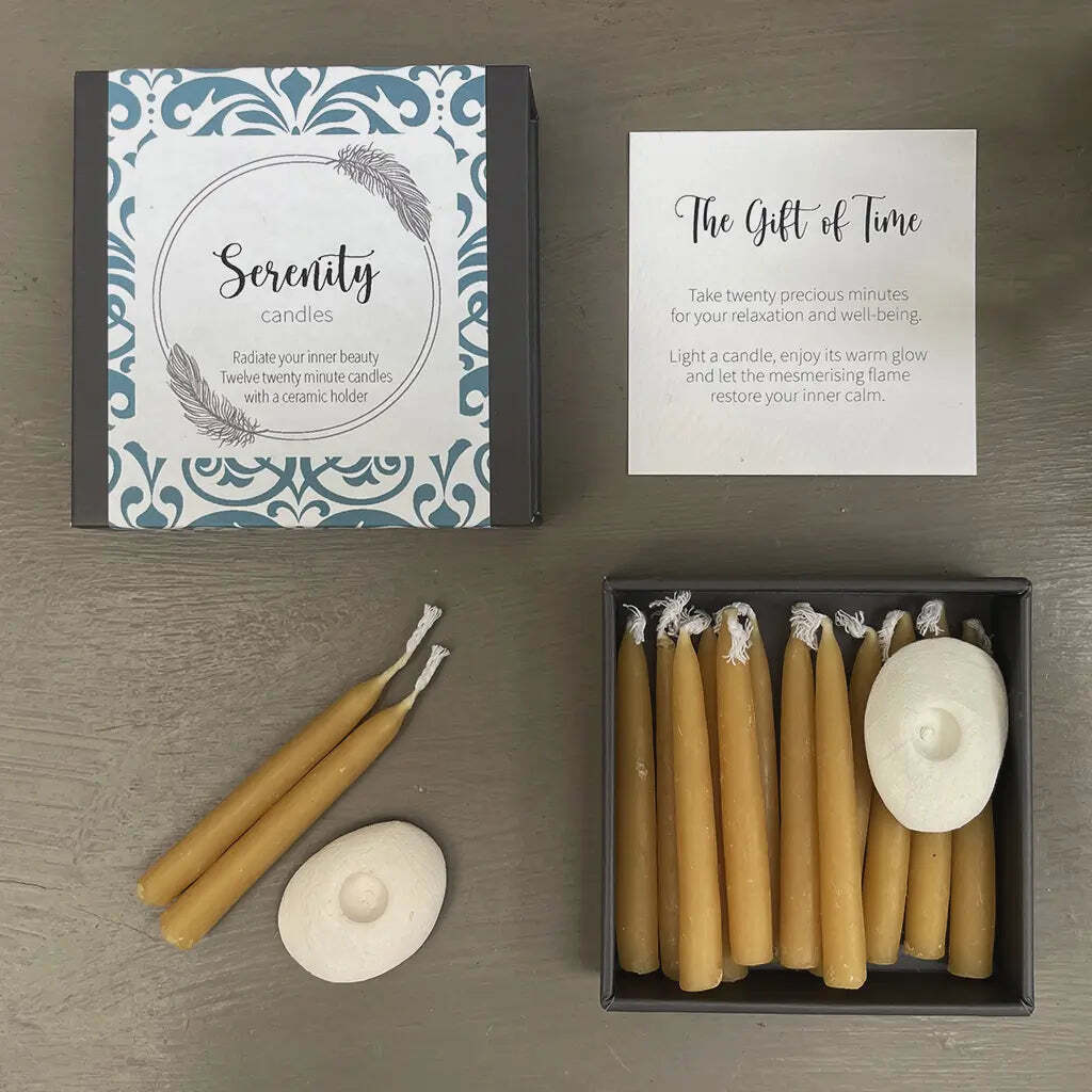 Serenity candles with packaging and instructions on a wooden surface