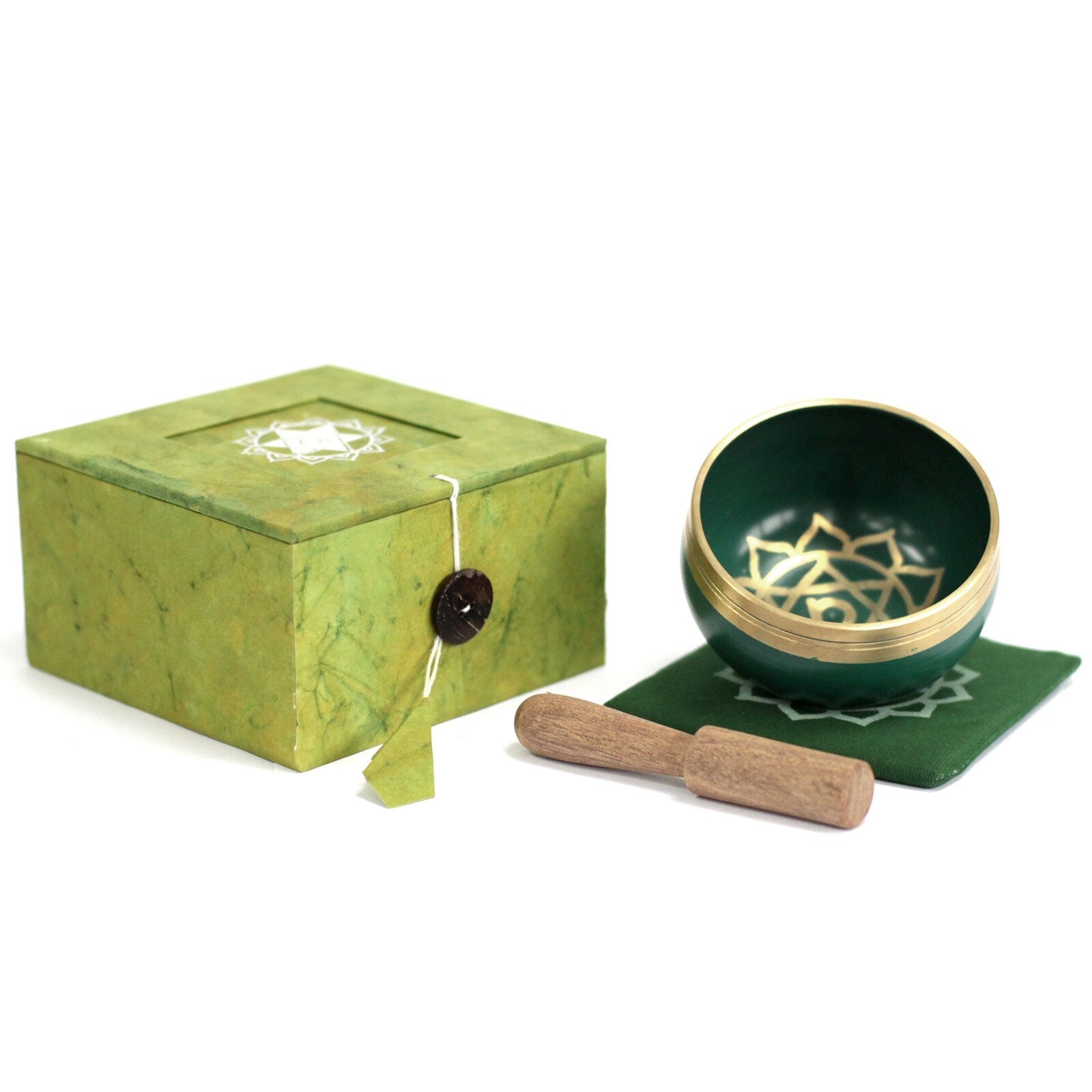 Green singing bowl set with box and mallet on a white background