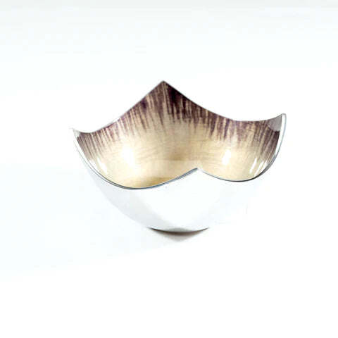 Decorative bowl with a metallic finish on a white background