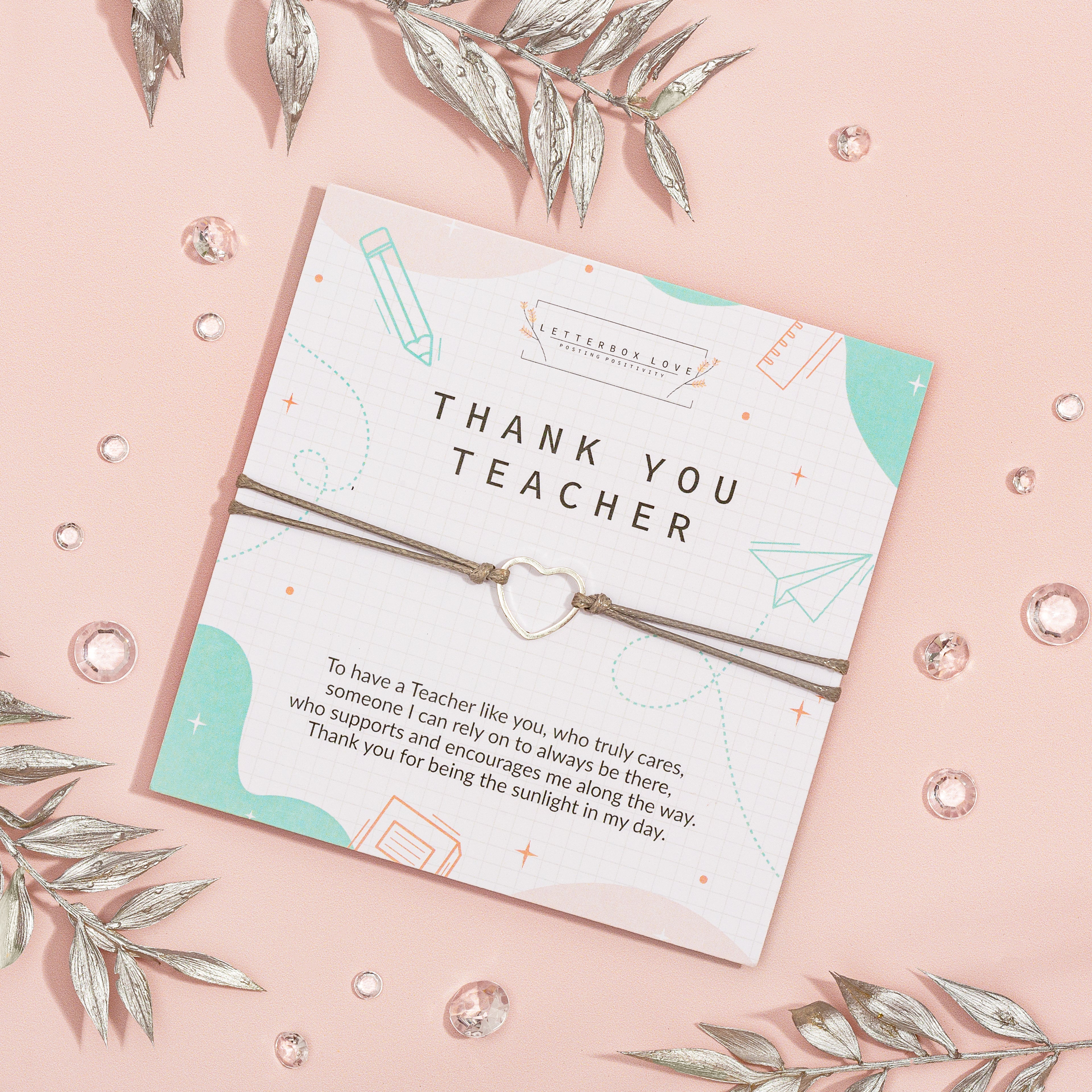 Greeting card with a thank you teacher message and decorative elements on a pink background