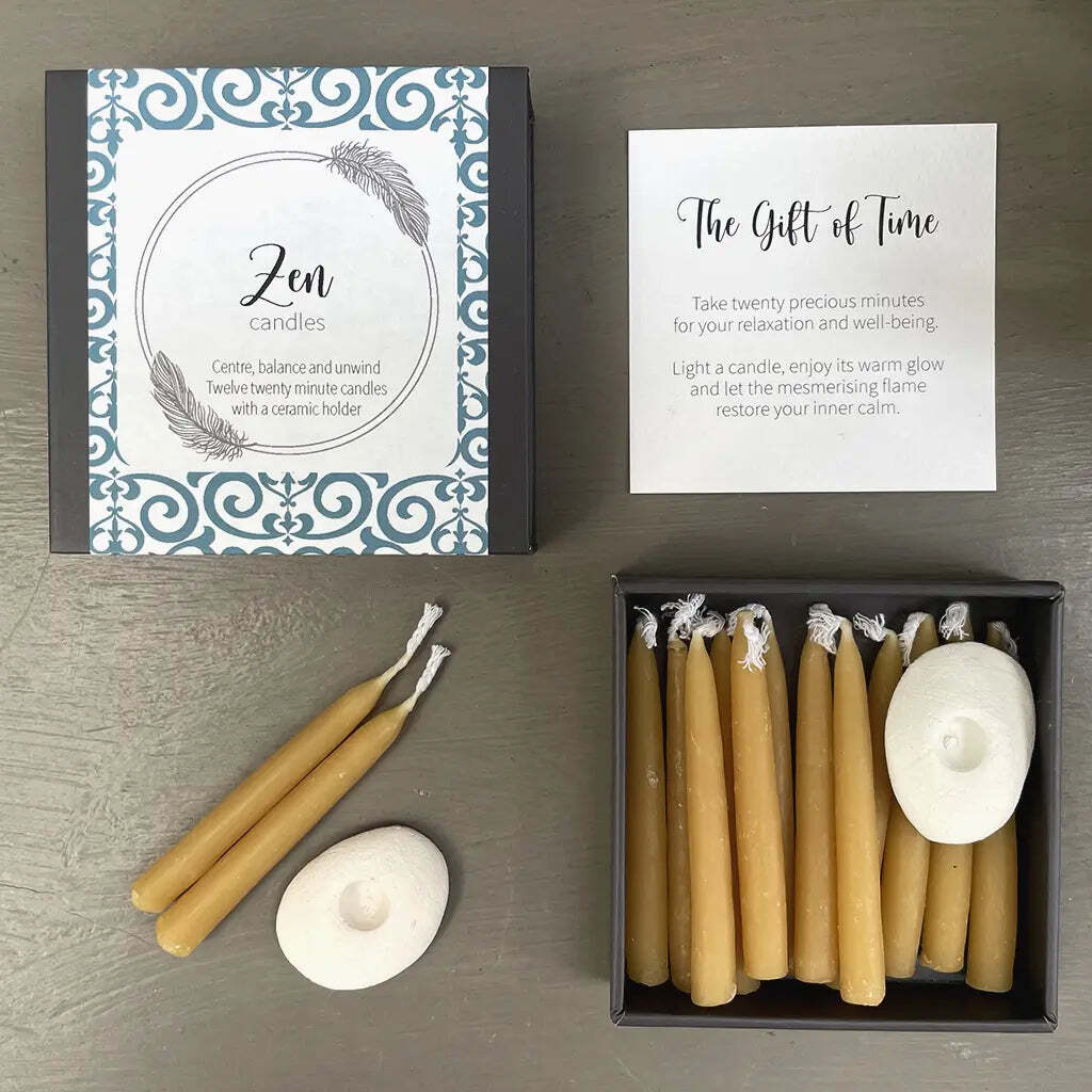 Zen candles set with packaging and instructions on a gray surface