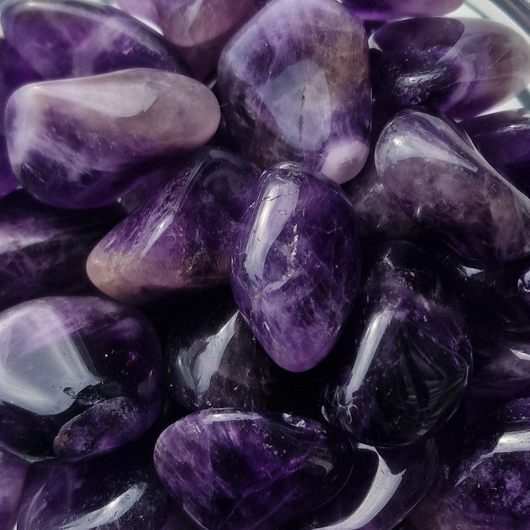 purple amethyst tumblestones in a group